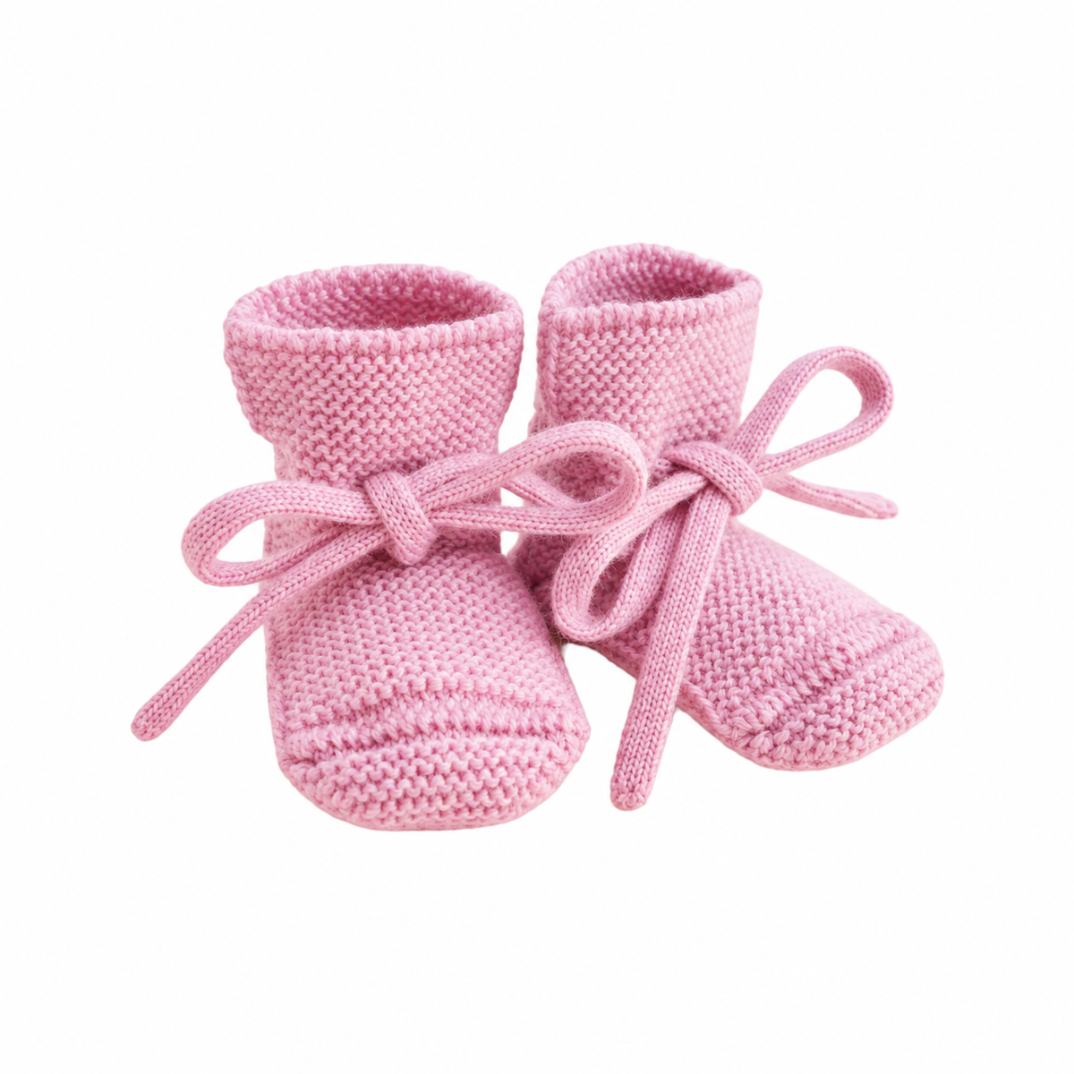 Hvid Booties babyslofjes van merinowol in zachtroze, vooraanzicht