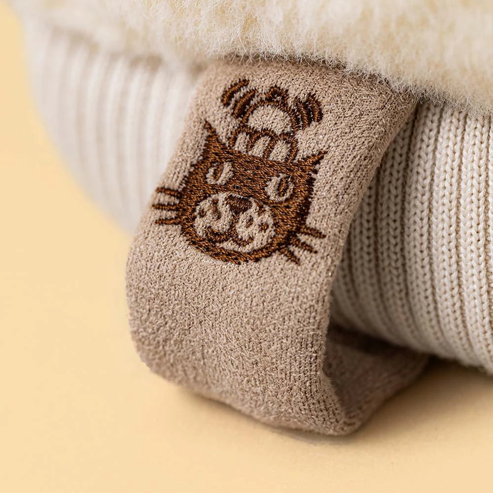 Jellycat Amuseables Fitswell Mitten, vooraanzicht van de crème want met gezichtje