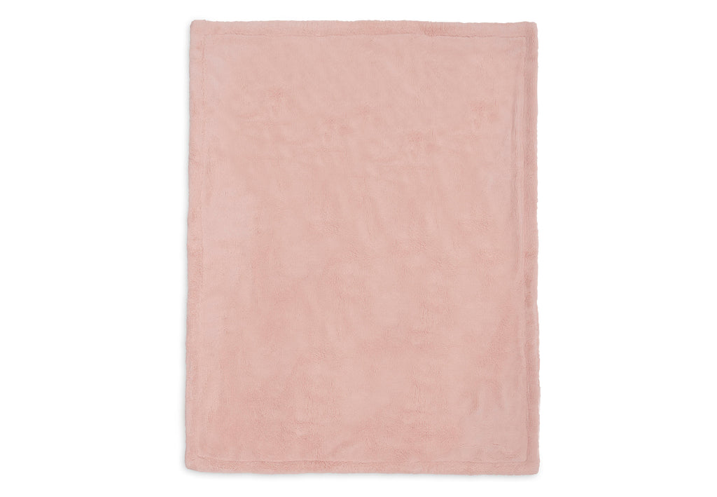 Pluizige achterkant van de roze Jollein babydeken