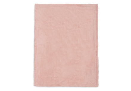 Pluizige achterkant van de roze Jollein babydeken