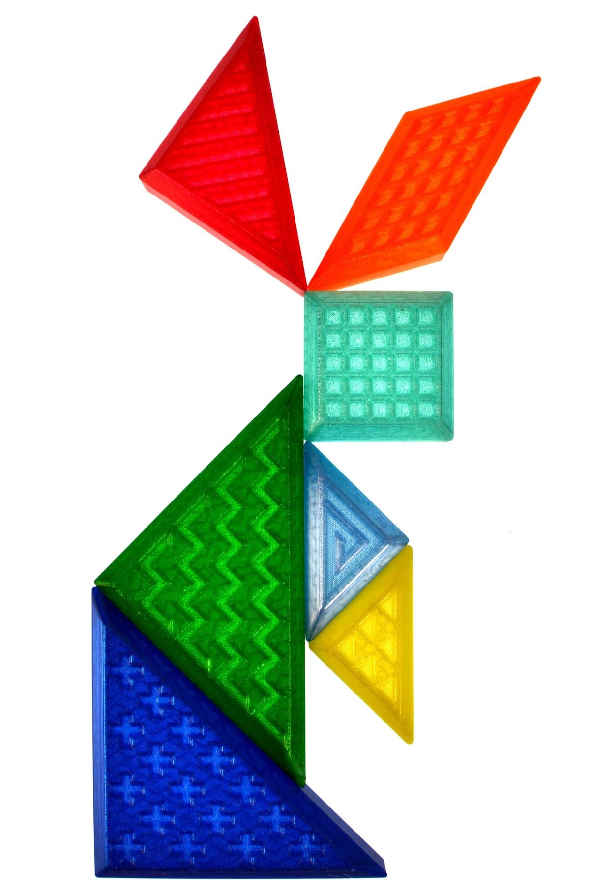 X Creator Play Tangram, acht transparante puzzelstukken in regenboogkleuren op witte achtergrond